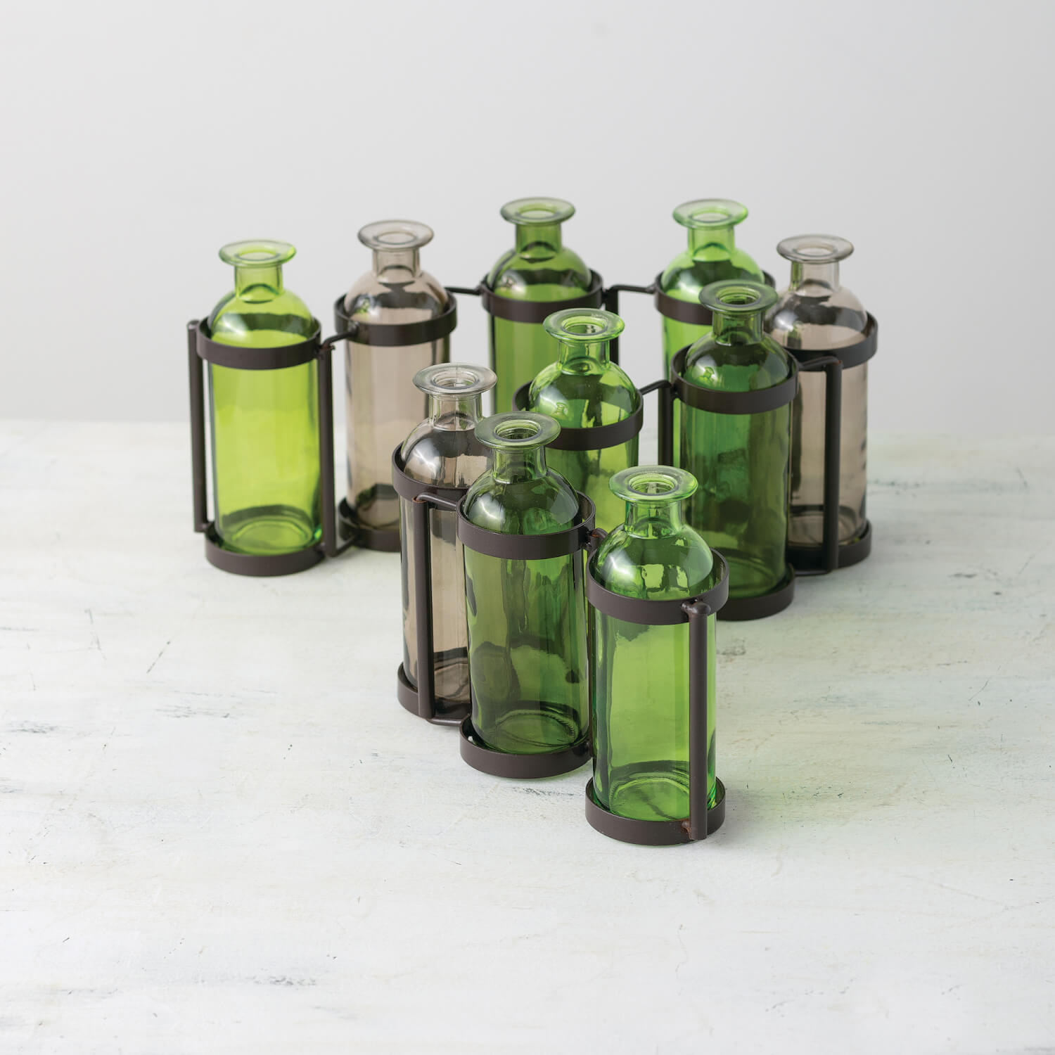 TEN GLASS BOTTLE VASE SET