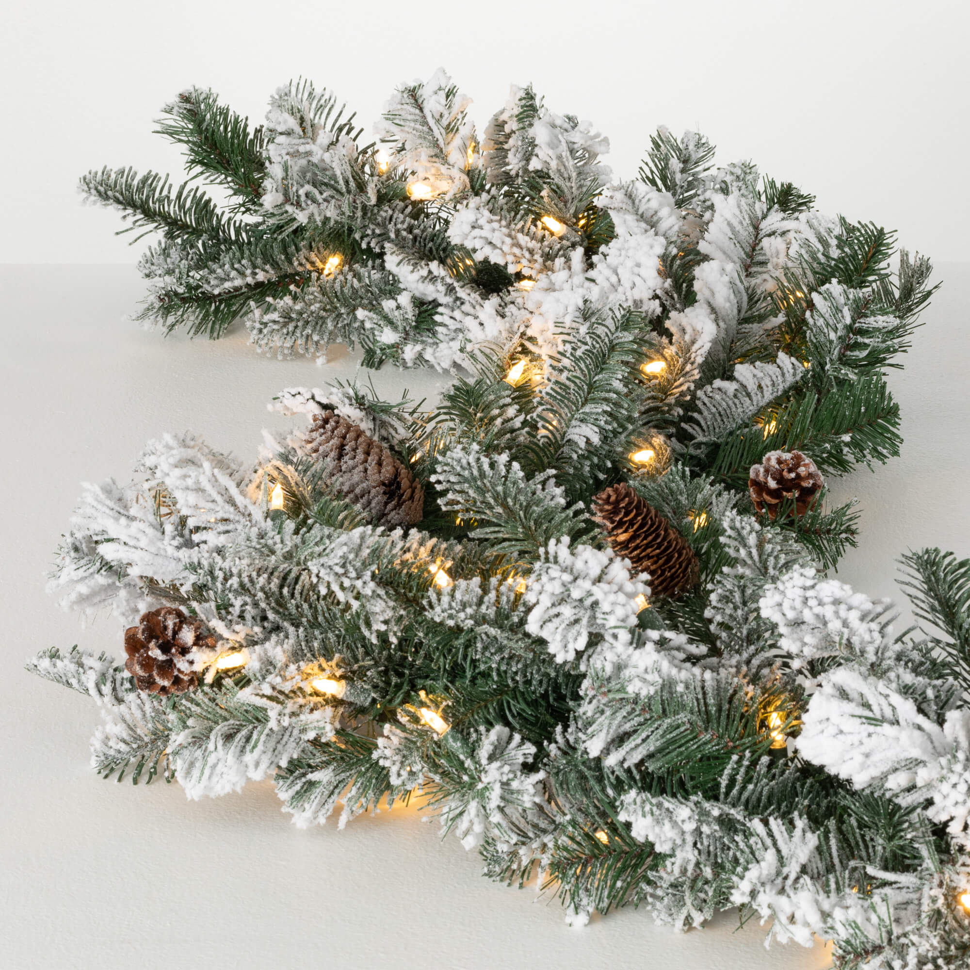 LIT FLOCKED PINE CONE GARLAND